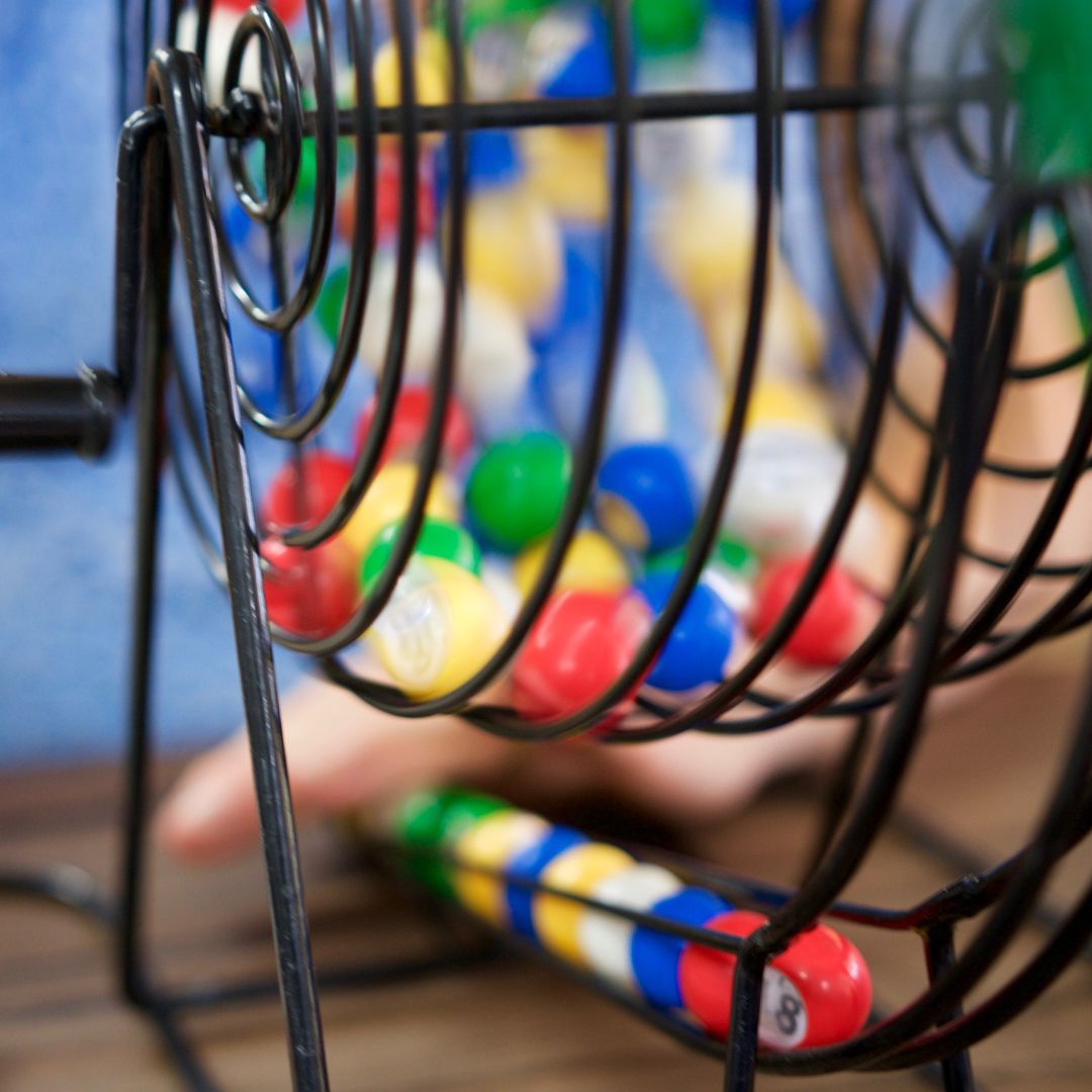A bingo cage filled with brightly coloured balls
