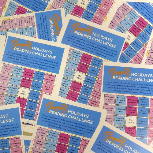 A pile of multi-coloured bingo-style cards, with each box listing an activity to complete as part of the challenge.