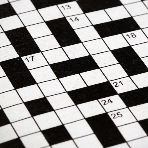 A beguilingly empty crossword grid, black and white on paper.